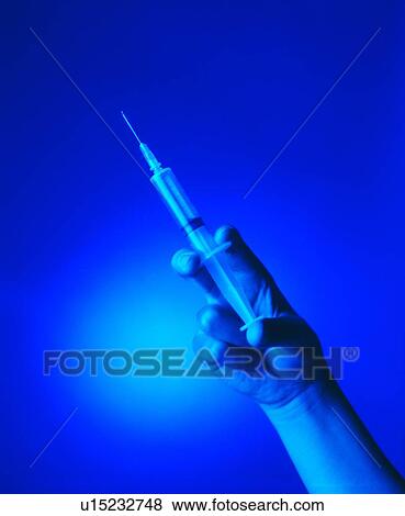 Stock Photo - Back Lit, Blue, Close-Up, Colored Background, Holding. Fotosearch