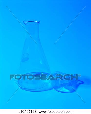 Stock Image - Beaker, Blue, Close-Up, Colored Background, Container. Fotosearch