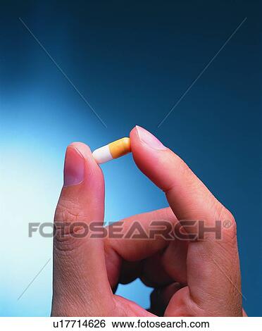Close-Up, Medication, Capsule, Human Finger, Indoor View Large Photo Image Stock Photograph - Close-Up, Medication, Capsule, Human Finger, Indoor. Fotosearch