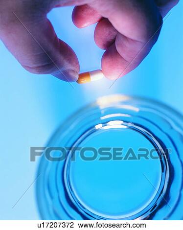 Stock Image - Healthcare And Medicine, Glass, Medication. Fotosearch