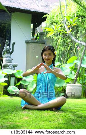 Barefoot, Cross-Legged, Brown Hair, Asian Ethnicity View Large Photo Image Picture - Barefoot, Cross-Legged, Brown Hair, Asian Ethnicity. Fotosearch