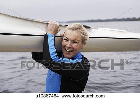 Woman Holding Kayak View Large Photo Image Picture - Woman Holding Kayak. Fotosearch