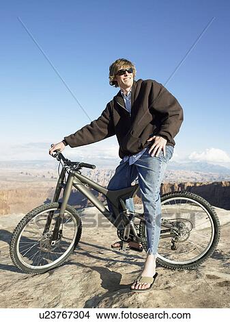 Young man with mountain bike View Large Photo Image Picture - Young man with mountain bike. Fotosearch