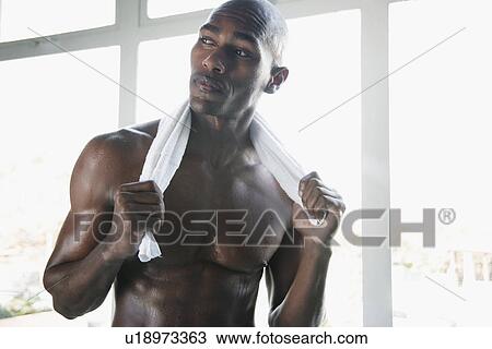 Young man with towel around neck (portrait) View Large Photo Image Stock Image - Young man with towel around neck (portrait). Fotosearch