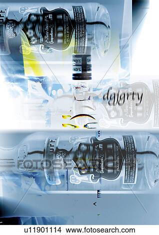 Close-up of liquor bottles superimposed on a grey background View Large Photo Image Picture - Close-up of liquor bottles superimposed on a grey background. Fotosearch