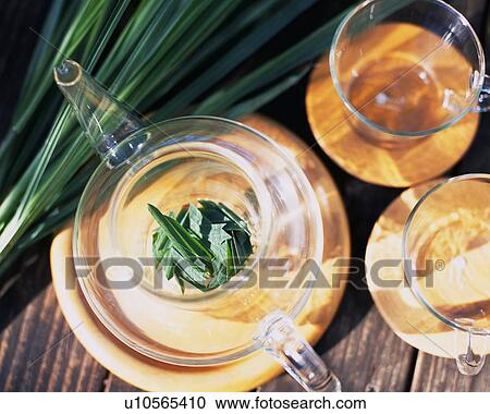 Lemongrass in a Tea Pot, Next toCups, High Angle View View Large Photo Image Stock Image - Lemongrass in a Tea Pot, Next toCups, High Angle View. Fotosearch