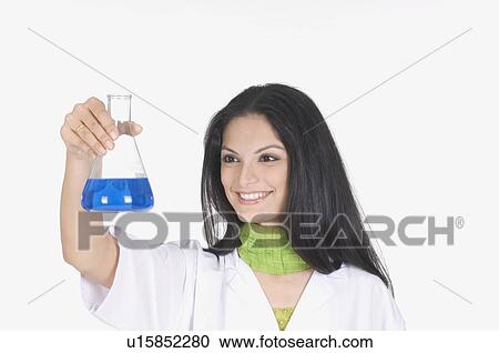 Close-up of a female technician holding a conical flask View Large Photo Image Stock Image - Close-up of a female technician holding a conical flask. Fotosearch