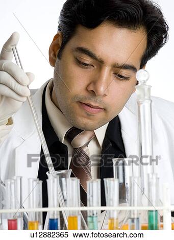 Stock Photography - Close-up of a scientist working in a laboratory. Fotosearch