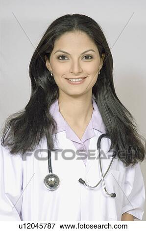 Portrait of a female doctor with a stethoscope around her neck View Large Photo Image Stock Photo - Portrait of a female doctor with a stethoscope around her neck. Fotosearch