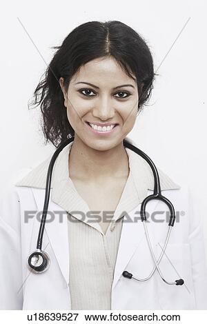 Portrait of a female doctor with a stethoscope around her neck View Large Photo Image Stock Photo - Portrait of a female doctor with a stethoscope around her neck. Fotosearch