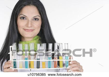 Portrait of a female technician holding a test tube rack View Large Photo Image Stock Photography - Portrait of a female technician holding a test tube rack. Fotosearch