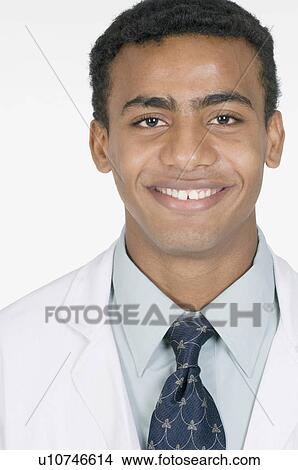 Portrait of a male doctor smiling View Large Photo Image Picture - Portrait of a male doctor smiling. Fotosearch