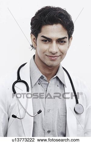 Portrait of a male doctor smiling View Large Photo Image Stock Image - Portrait of a male doctor smiling. Fotosearch