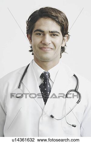 Stock Image - Portrait of a male doctor smiling. Fotosearch