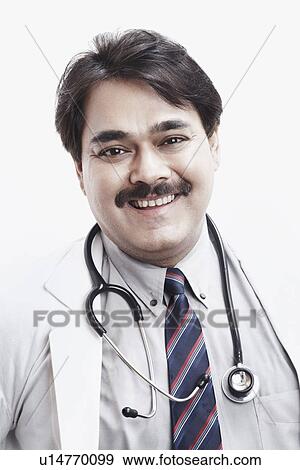 Stock Photo - Portrait of a male doctor smiling. Fotosearch