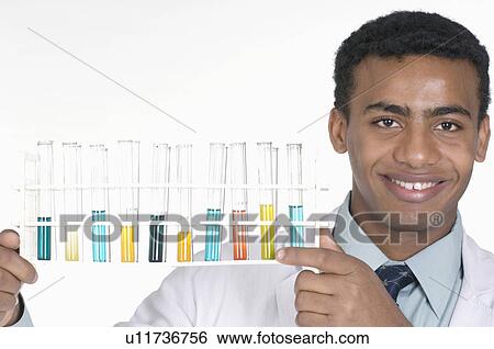 Portrait of a male technician holding a test tube rack View Large Photo Image Stock Photograph - Portrait of a male technician holding a test tube rack. Fotosearch