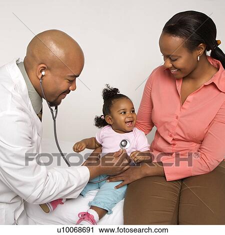 African-American male doctor examining baby girl with mother watching. View Large Photo Image Stock Image - African-American male doctor examining baby girl with mother watching.. Fotosearch