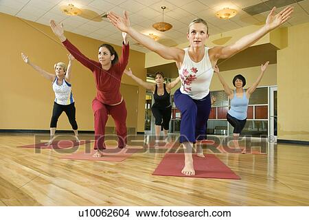 Prime adult female Caucasians in yoga class. View Large Photo Image Picture - Prime adult female Caucasians in yoga class.. Fotosearch
