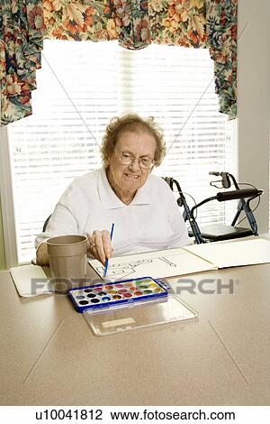 Elderly Caucasian woman painting with watercolors at retirement community center. View Large Photo Image Stock Image - Elderly Caucasian woman painting with watercolors at retirement community center.. Fotosearch