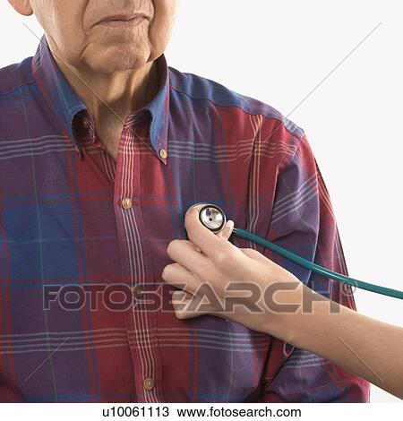 Mid-adult Caucasian female hand with stethoscope at elderly Caucasian male's chest. View Large Photo Image Stock Image - Mid-adult Caucasian female hand with stethoscope at elderly Caucasian male's chest.. Fotosearch