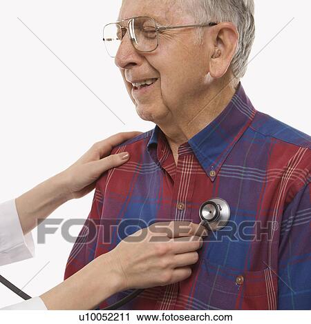 Mid-adult Caucasian female hands listening to elderly Caucasian male's heart with stethoscope. View Large Photo Image Stock Image - Mid-adult Caucasian female hands listening to elderly Caucasian male's heart with stethoscope.. Fotosearch