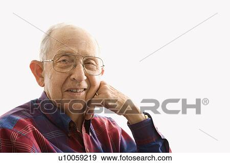 Portrait of smiling Caucasion elderly man with face propped on hand. View Large Photo Image Stock Photo - Portrait of smiling Caucasion elderly man with face propped on hand.. Fotosearch