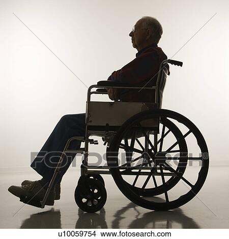 Profile view of silhouetted Caucasion elderly man sitting in wheelchair. View Large Photo Image Picture - Profile view of silhouetted Caucasion elderly man sitting in wheelchair.. Fotosearch