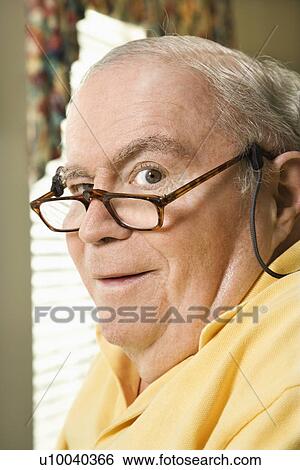 Senior Caucasian man with bifocals. View Large Photo Image Stock Photograph - Senior Caucasian man with bifocals.. Fotosearch