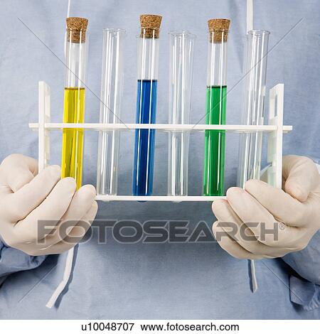 Close-up of male surgeon's hands holding test tube tray. View Large Photo Image Stock Photo - Close-up of male surgeon's hands holding test tube tray.. Fotosearch