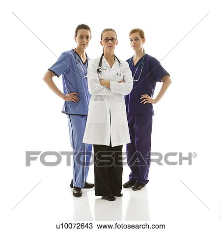 Full-length portrait of Caucasian women healthcare workers in uniforms standing against white background. View Large Photo Image Stock Image - Full-length portrait of Caucasian women healthcare workers in uniforms standing against white background.. Fotosearch