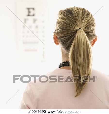 Mid-adult African-American doctor with clipboard and Caucasion mid-adult female patient in doctor's office looking at viewer and smiling. View Large Photo Image Stock Image - Mid-adult African-American doctor with clipboard and Caucasion mid-adult female patient in doctor's office looking at viewer and smiling.. Fotosearch