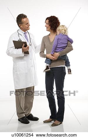 Middle-aged adult Caucasian male doctor introducing himself to mid-adult mother and her daughter. View Large Photo Image Picture - Middle-aged adult Caucasian male doctor introducing himself to mid-adult mother and her daughter.. Fotosearch