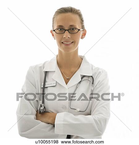 Portrait of smiling Caucasian woman doctor standing against white background. View Large Photo Image Stock Photo - Portrait of smiling Caucasian woman doctor standing against white background.. Fotosearch