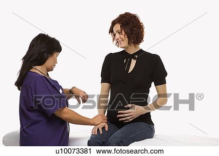 Pregnant Caucasian mid-adult woman having vital signs checked by nurse. View Large Photo Image Stock Image - Pregnant Caucasian mid-adult woman having vital signs checked by nurse.. Fotosearch
