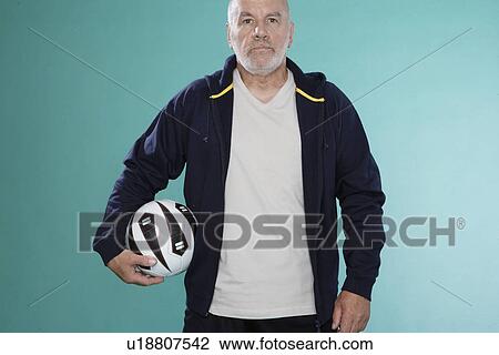 Senior man with soccer ball View Large Photo Image Stock Image - Senior man with soccer ball. Fotosearch