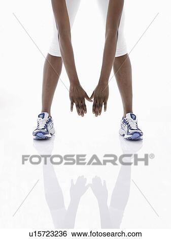 Woman stretching legs (low section) View Large Photo Image Stock Photograph - Woman stretching legs (low section). Fotosearch