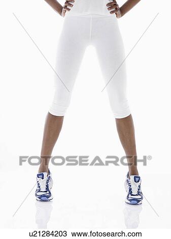Woman wearing tracksuit pants and sneakers (low section) View Large Photo Image Stock Image - Woman wearing tracksuit pants and sneakers (low section). Fotosearch