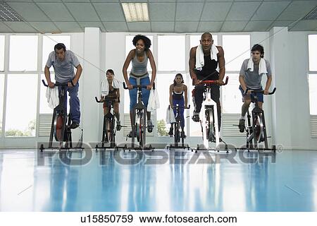 Group indoor cycling View Large Photo Image Stock Photo - Group indoor cycling. Fotosearch