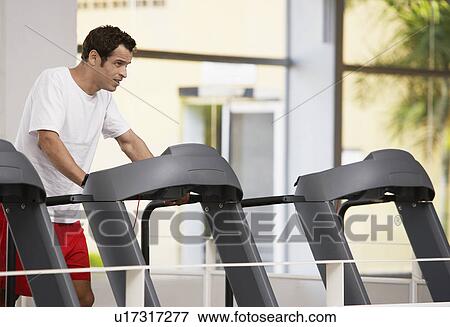 Man on treadmill View Large Photo Image Stock Photo - Man on treadmill. Fotosearch