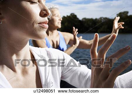 Two women doing tai chi View Large Photo Image Stock Image - Two women doing tai chi. Fotosearch