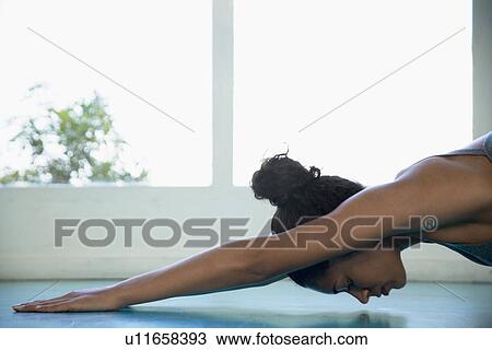 Woman stretching View Large Photo Image Stock Image - Woman stretching. Fotosearch