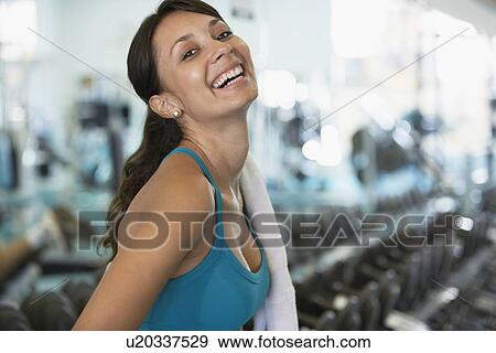 Young woman in gym (portrait) View Large Photo Image Stock Photo - Young woman in gym (portrait). Fotosearch