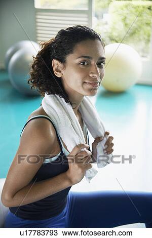 Young woman with towel around neck (portrait) View Large Photo Image Stock Image - Young woman with towel around neck (portrait). Fotosearch