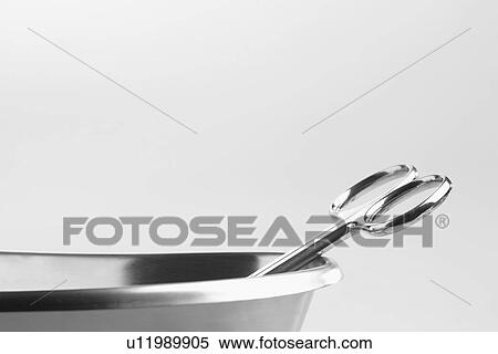 Medical scissor in stainless steel bowl (close-up) View Large Photo Image Stock Photography - Medical scissor in stainless steel bowl (close-up). Fotosearch