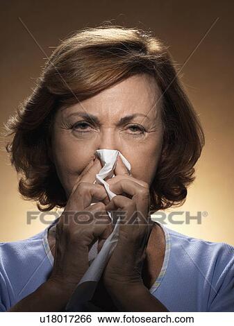 Woman blowing nose View Large Photo Image Stock Photograph - Woman blowing nose. Fotosearch