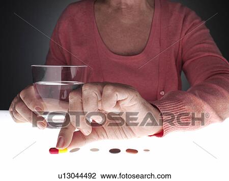 Woman taking pill (close-up) View Large Photo Image Stock Image - Woman taking pill (close-up). Fotosearch