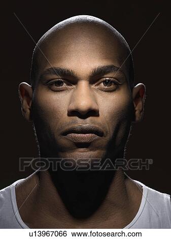 Stock Photograph - Confident young man (portrait). Fotosearch