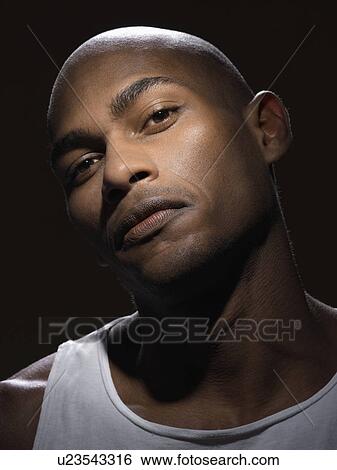 Stock Photograph - Confident young man (portrait). Fotosearch