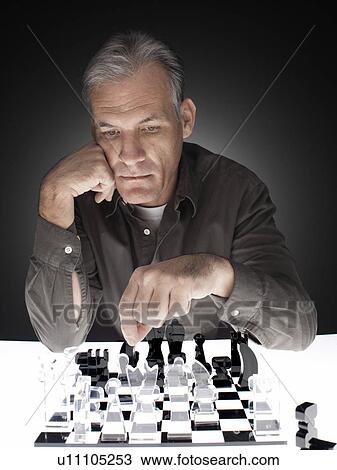 Man playing chess View Large Photo Image Stock Image - Man playing chess. Fotosearch