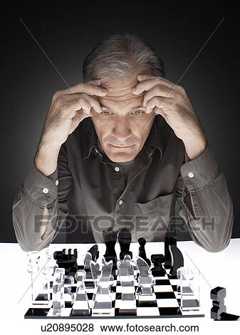 Man playing chess View Large Photo Image Stock Photo - Man playing chess. Fotosearch